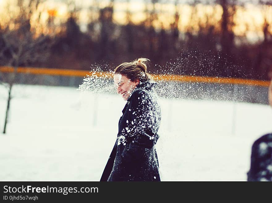 Woman In Black Coat Hit With Snowball On The Head