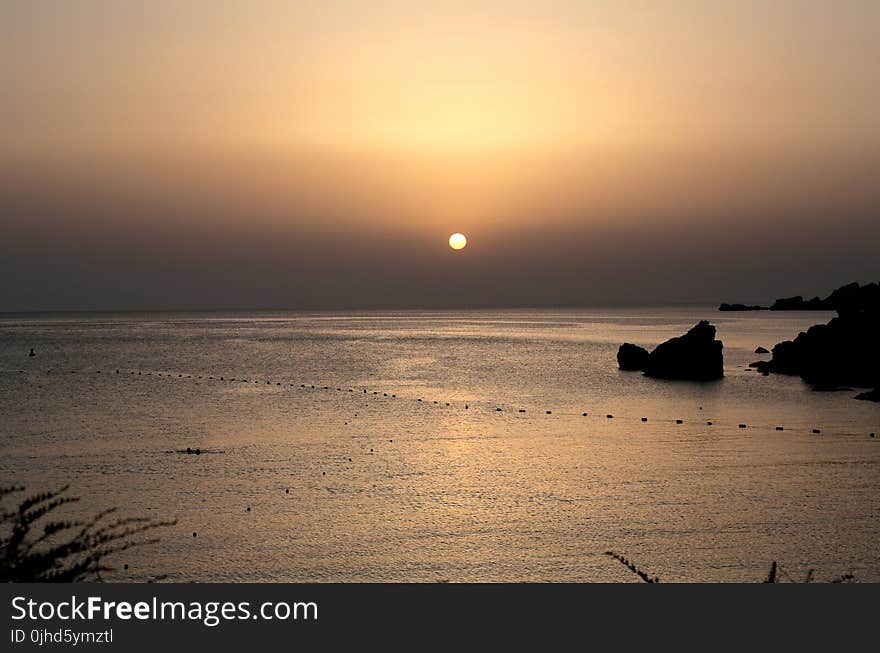 Scenic View of Ocean During Dawn