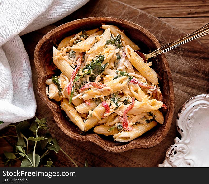 Cooked Pasta on Brown Wooden Bowl