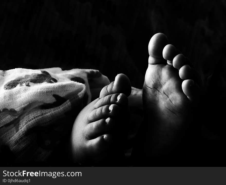 Grascale Photography of Toddlers Foot