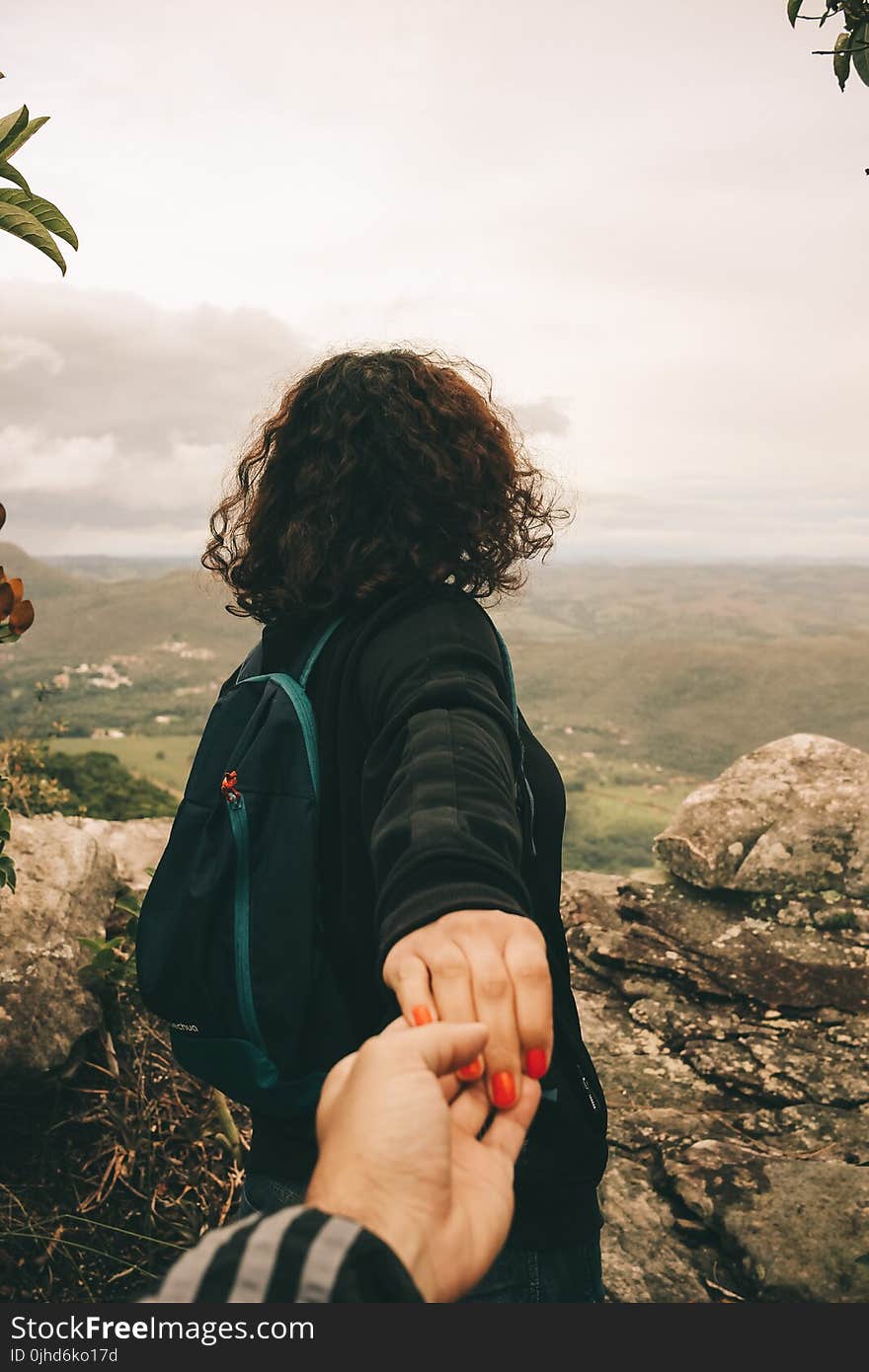 Woman Wearing Black Long-sleeved Shirt Holding Someone&#x27;s Hand