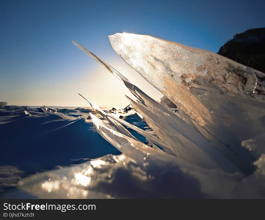 Closeup Photography of Frozen Water on Sand