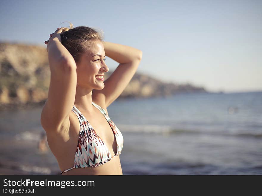 Blonde Haired Woman Wearing White 2-piece Swimsuit