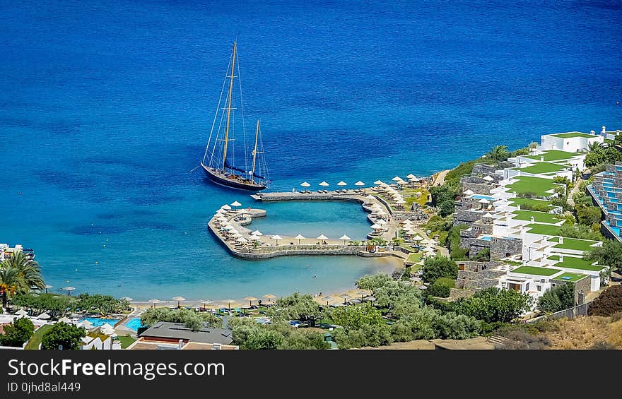 Sail Boat In Body Of Water