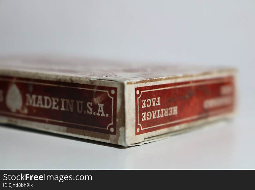 Close-Up Photography of Dirty Playing Card Box