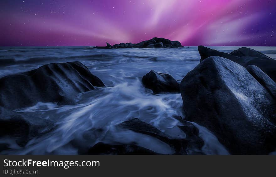 Time Lapsed Photo of Sea During Night Time