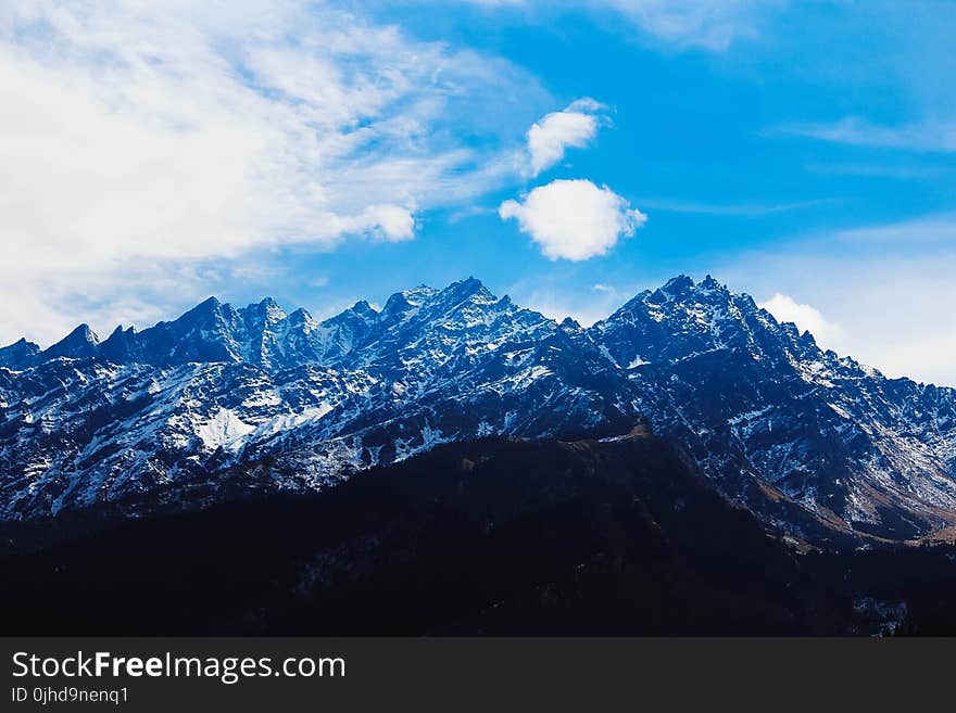 Mountain Under White Clouds at Daytime