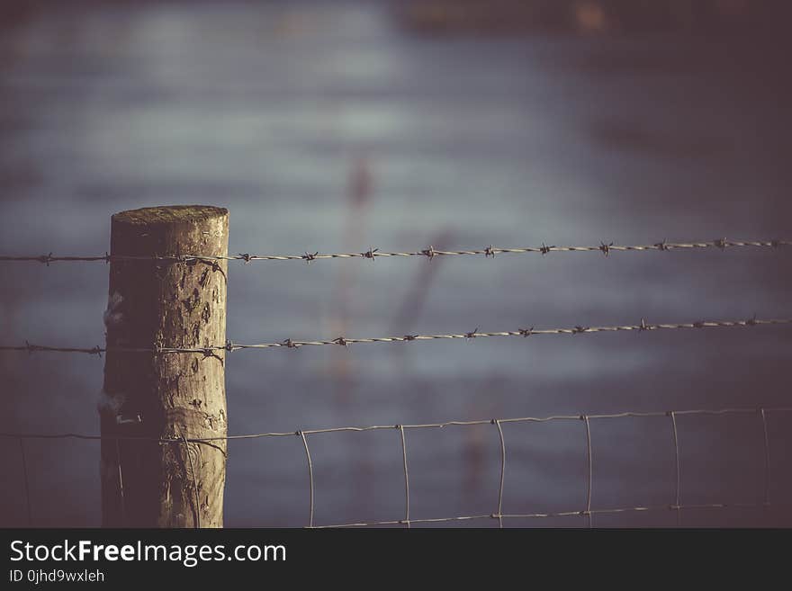 Selective Focus Photography Of Fence