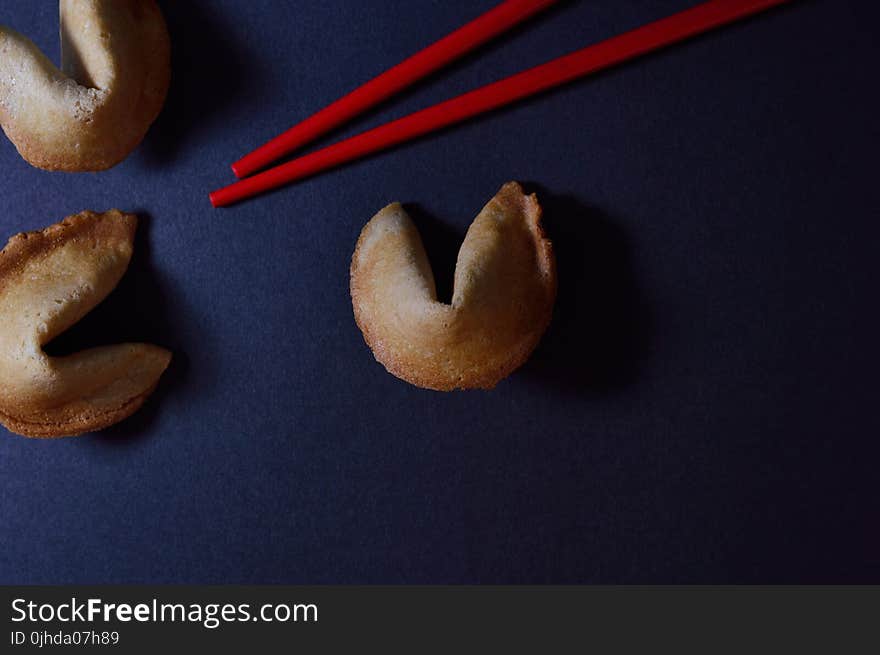 Baked Pastries Beside Red Chopsticks