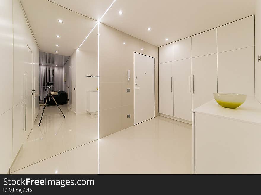 White Wooden Cabinet Beside White Wooden Door