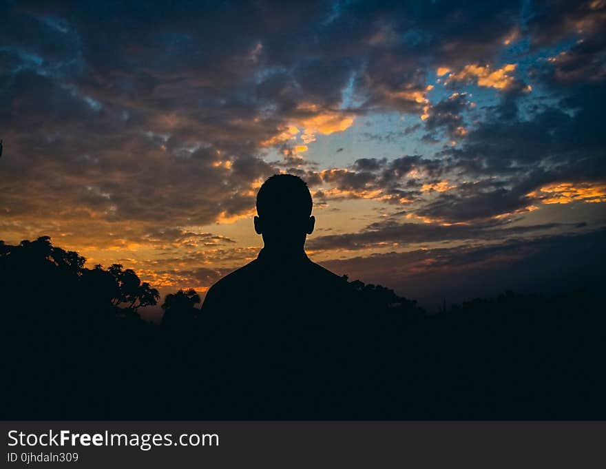 Silhouette Of Man Watching Golden Hour