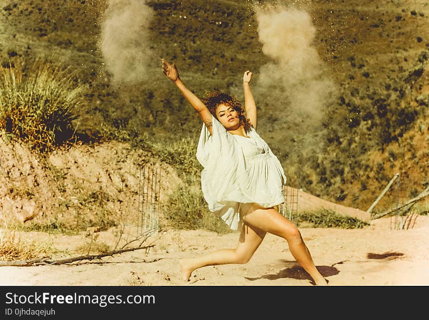 Woman in White Dress Dancing