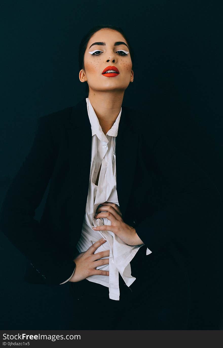 Woman Wearing Black Formal Suit Jacket Doing Pose