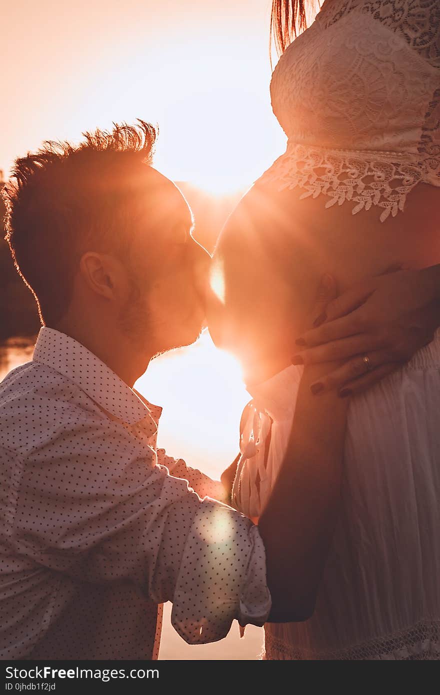 Man Kissing Woman&#x27;s Belly