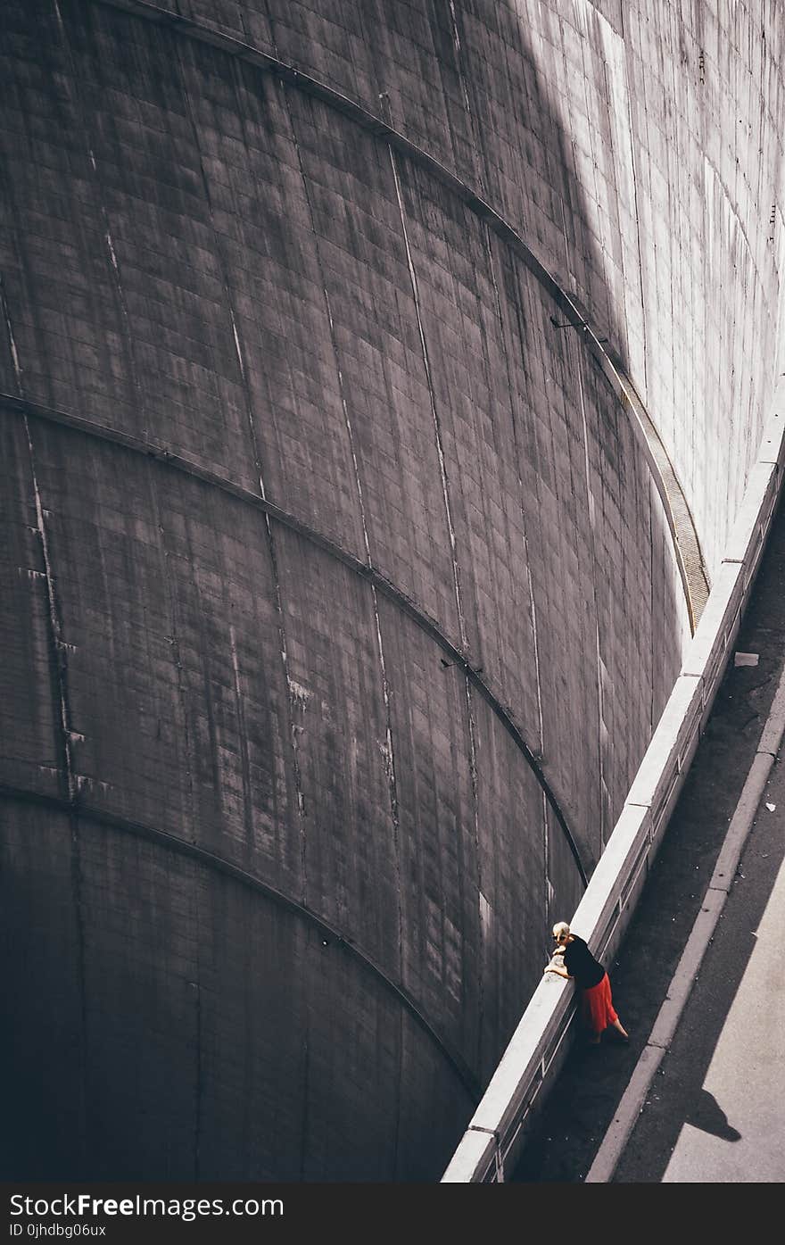 Woman Wearing Black Shirt Looking Down Through Hoover&#x27;s Dam