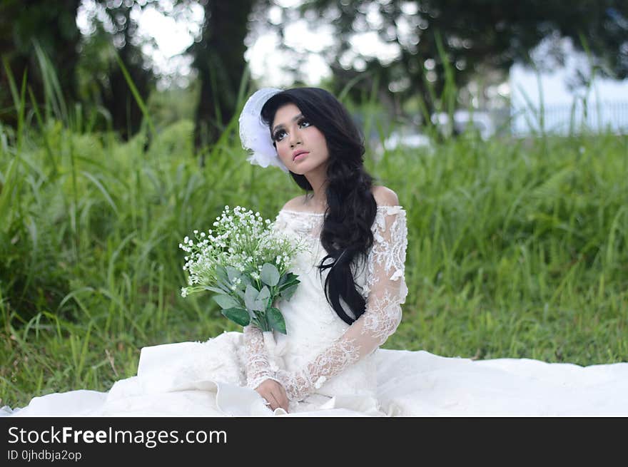 Woman Wearing of White Off-shoulder Bridal Dress