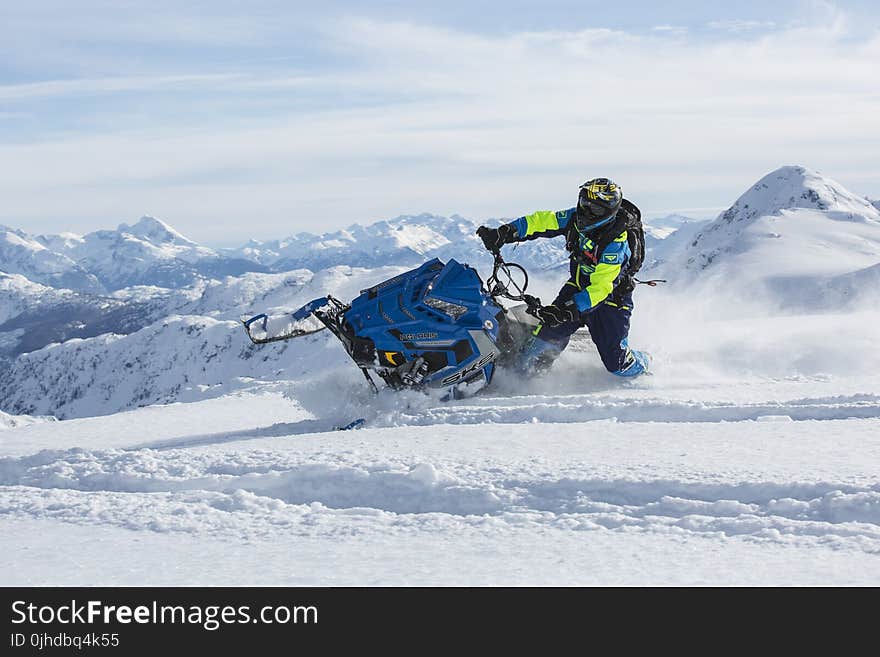 Man Riding Blue Snow Ski Scooter