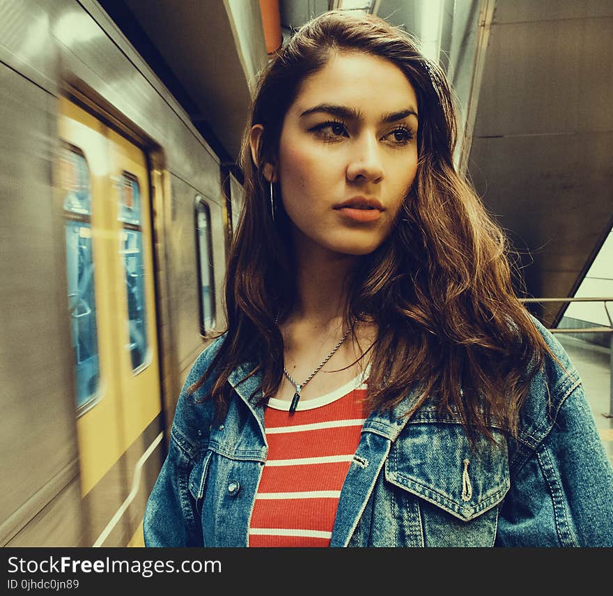 Photo of a Woman Wearing Blue Denim Jacket