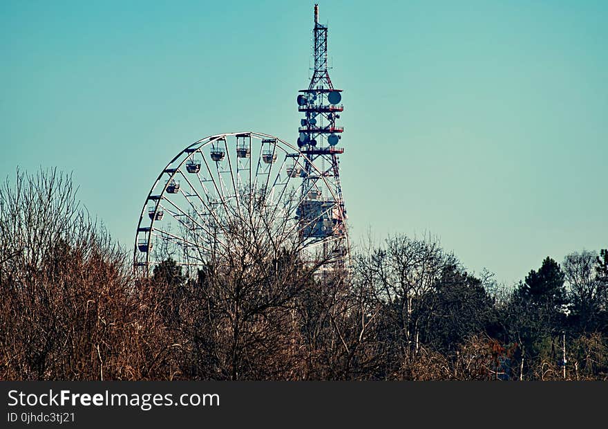 Photo of a Ferris Wheel Beside Tower