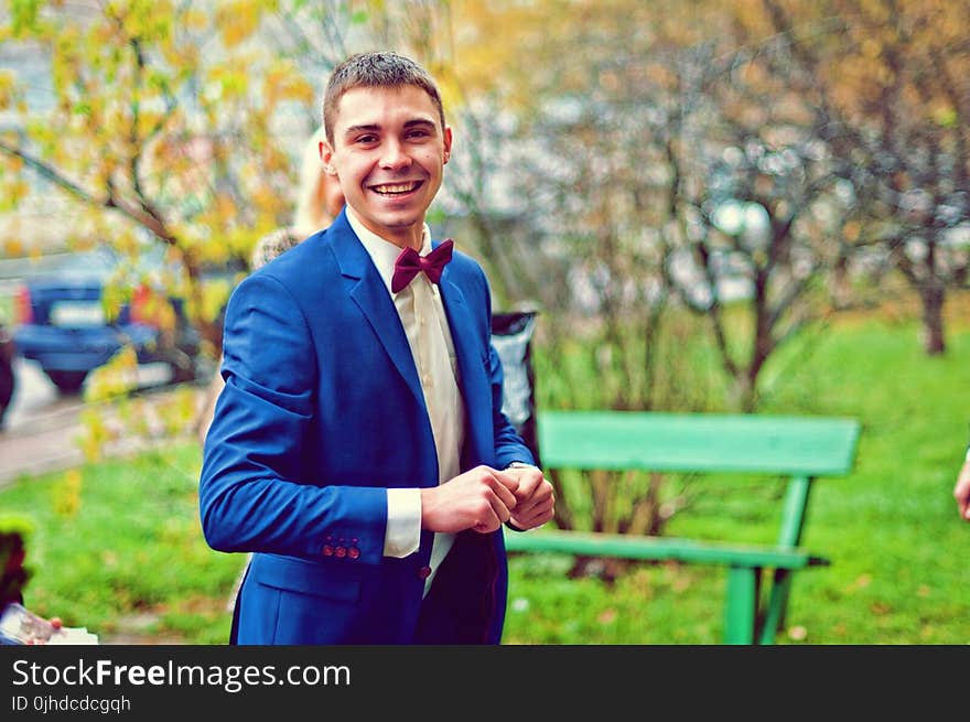 Man Wearing Blue Suit in Park