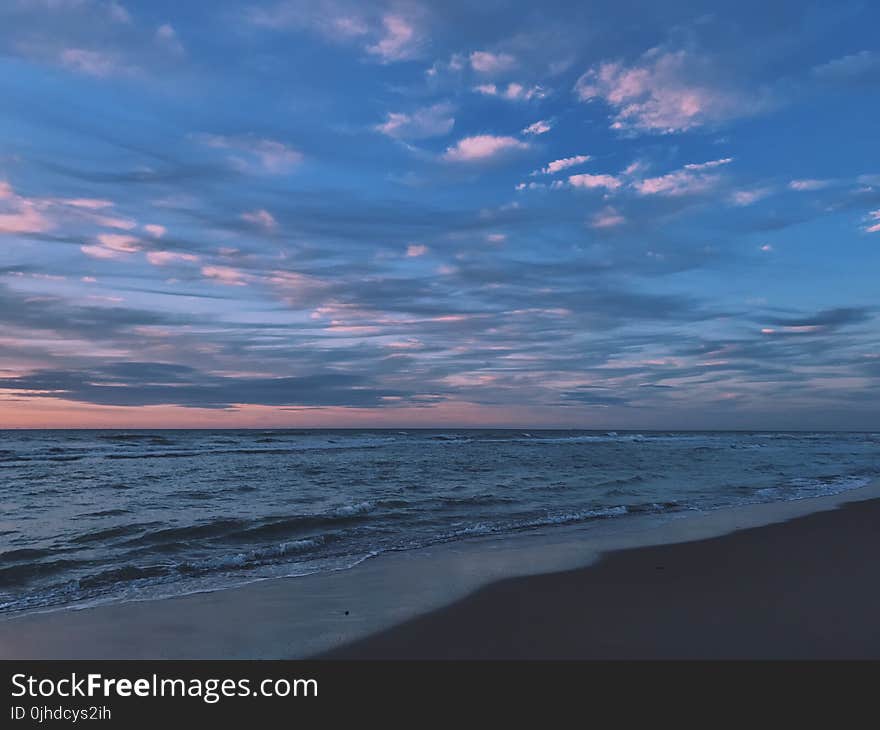 Scenic View of Ocean During Dawn