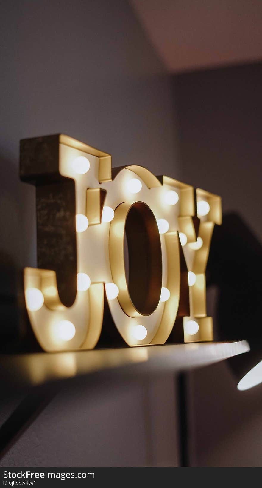 Selective Focus Photography of Joy Free Standing Letters With Lights