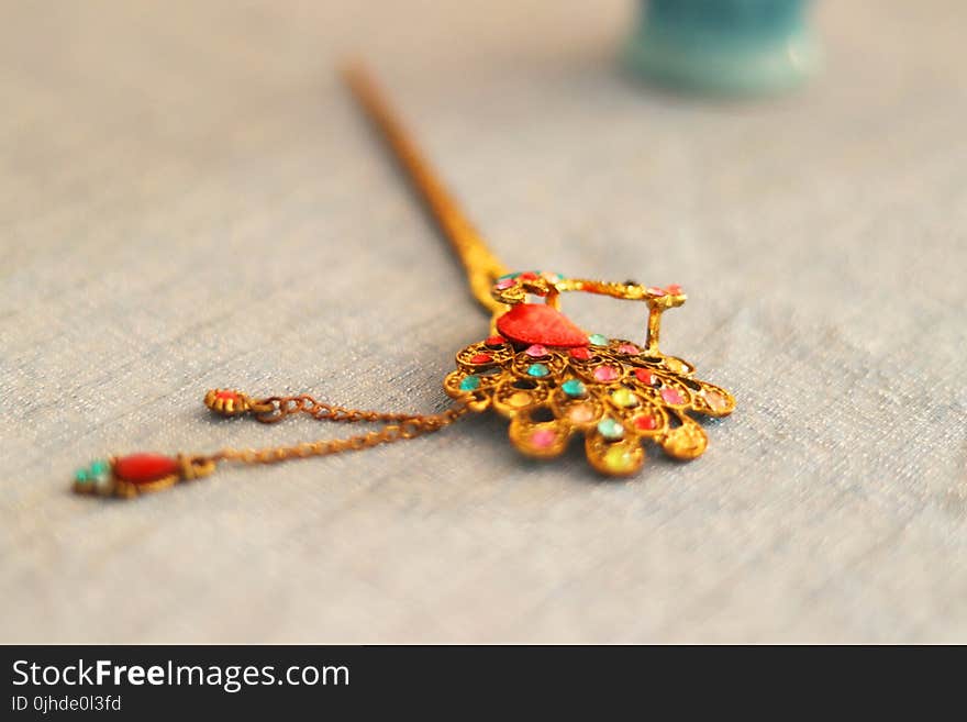 Focus Photography of Yellow and Multi-colored Hair Stick