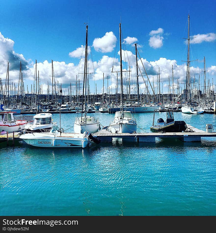 Three White Motorboat on Body of Water