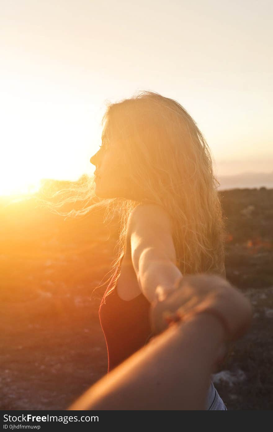 Photo of a Woman at Sunset