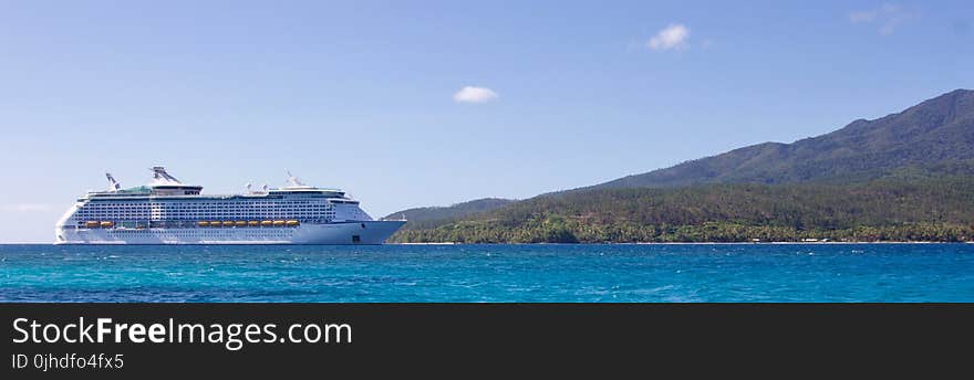 White Cruise Ship Near Island