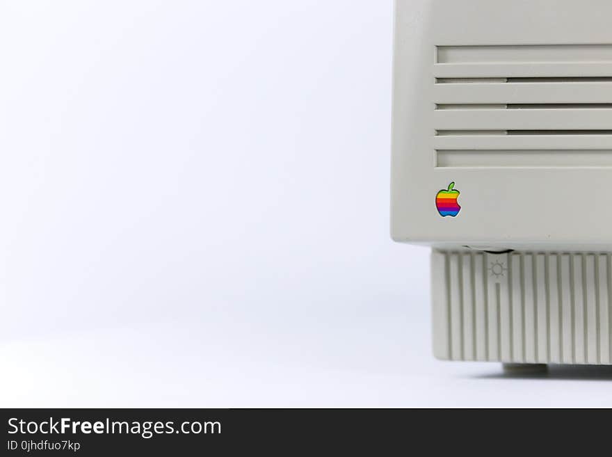 Gray Device With Apple Logo on White Surface