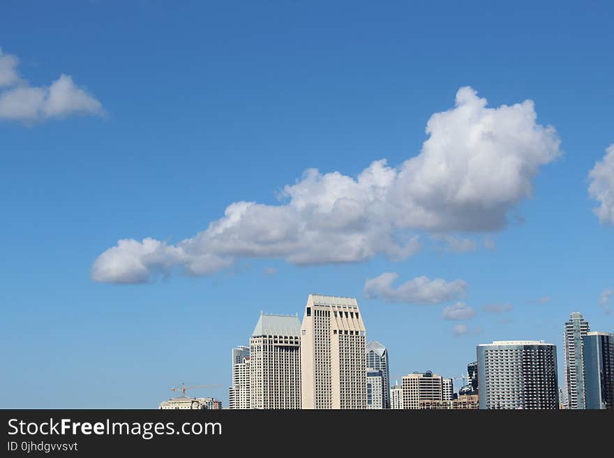 Cumulus Clouds Above High-rise Building