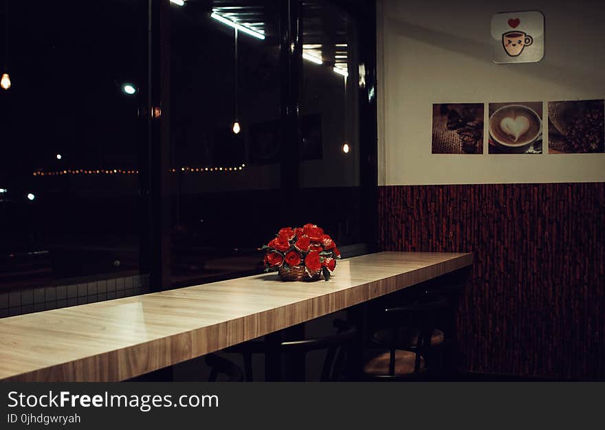 Red Rose Arrangement Decor on Brown Wooden Desk