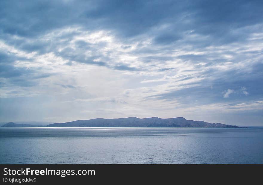 Panoramic Photography of Glacier Mountain Below White Clouds