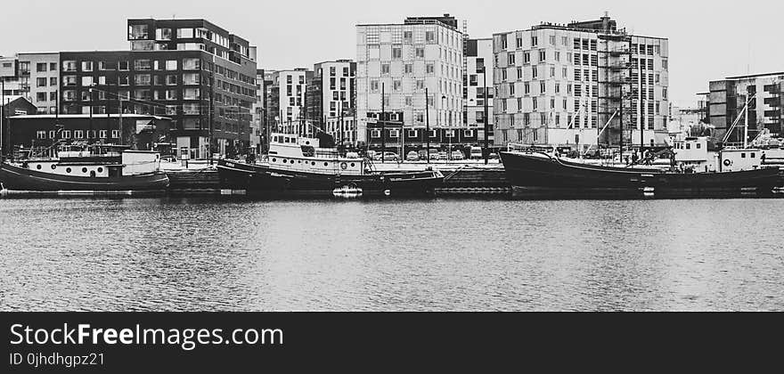 Grayscale Photography Of Buildings And River