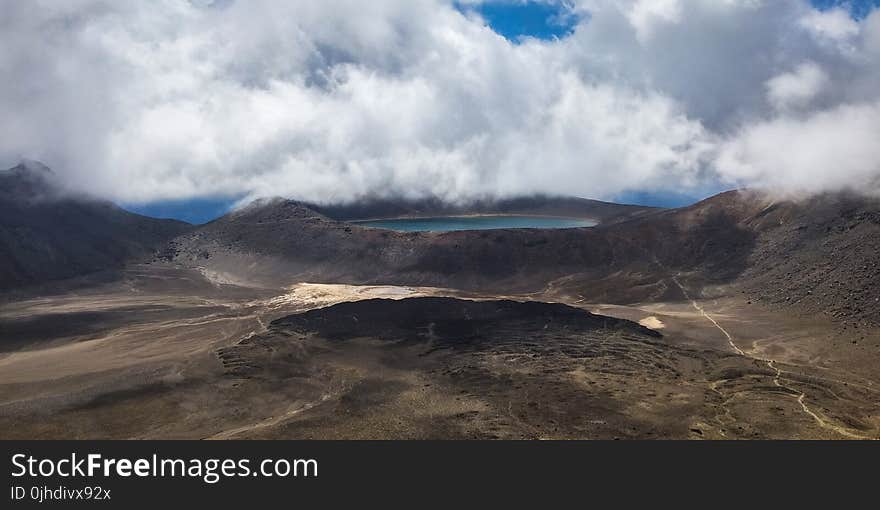 Aerial Photo of Lake Under Clouds