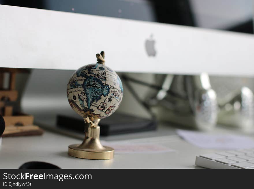 Globe On Top Of White Wooden Table