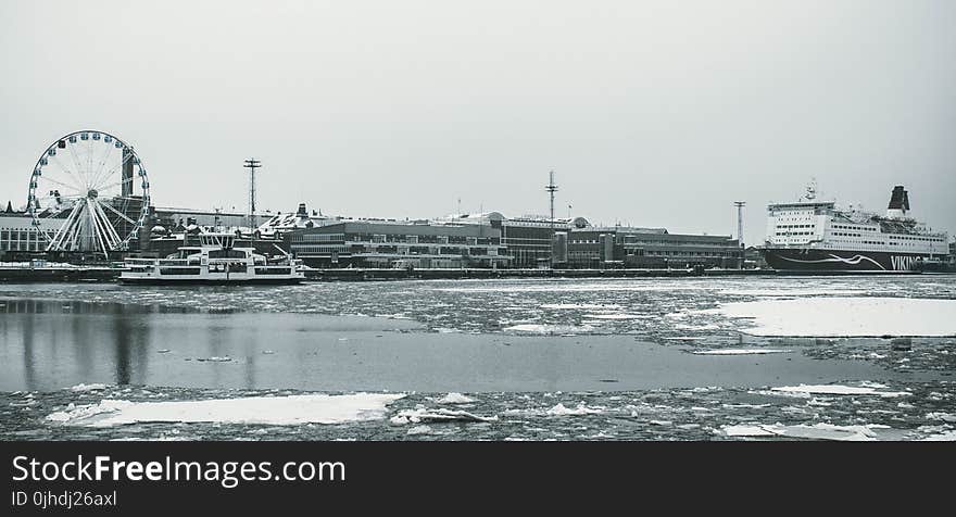 Grayscale Photography Of Ship On Body Of Water