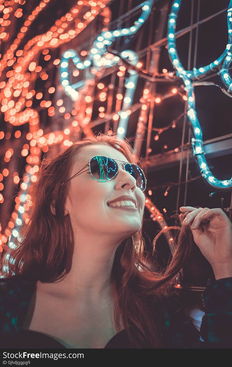 Woman Wearing Sunglasses Holding Her Hair