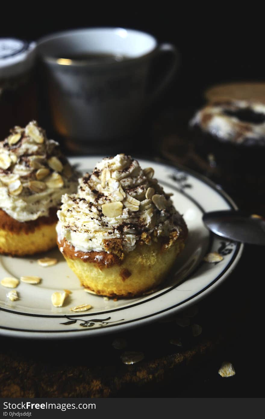 Baked Cupcakes With White-frosting With Almond Nuts