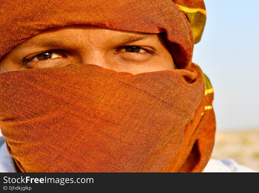 Man Cover Face Using Scarf