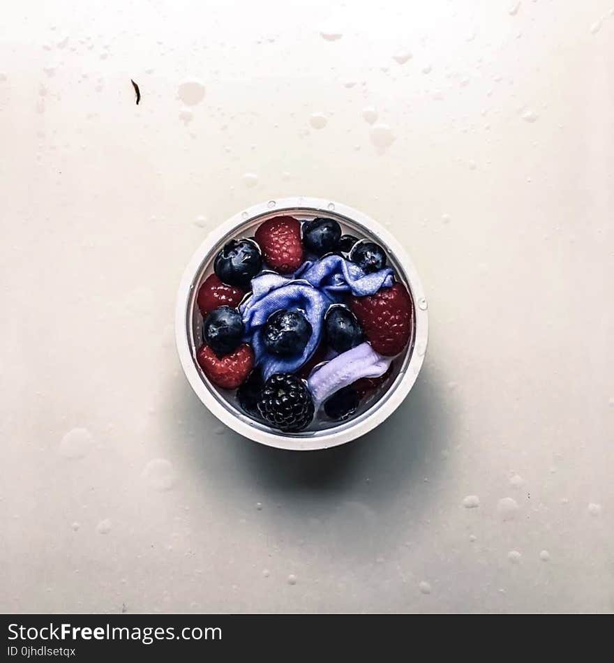 Flat Lay Photo of Berries in Container