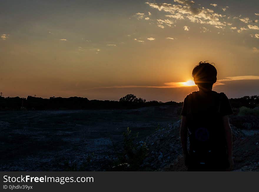 Silhouette of a Boy During Sunset