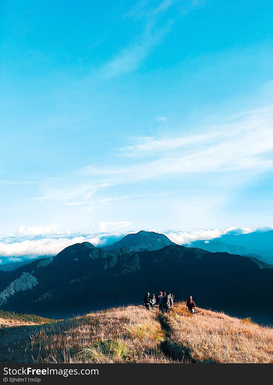 People Walking on Top of Mountain