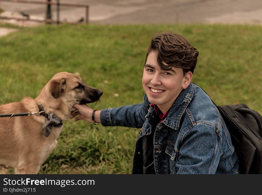 Man Wearing Blue Denim Jacket