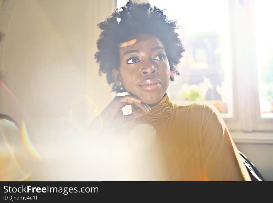 Woman In Yellow Turtle-neck Long-sleeved Top Posing For Photo