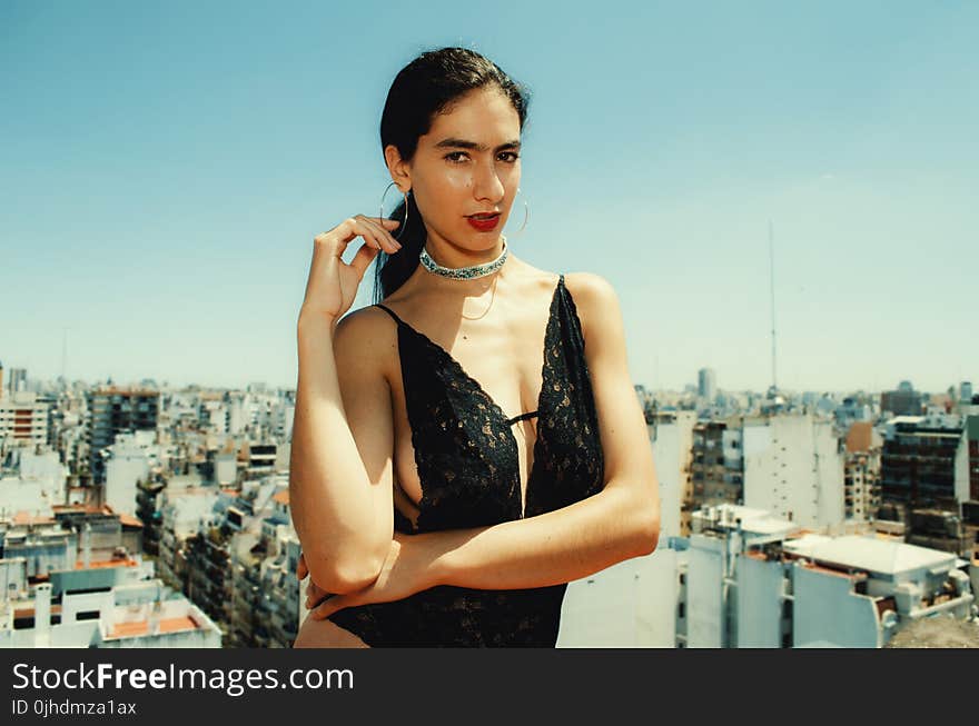 Woman Wearing Black Monokini Behind Highrise Building