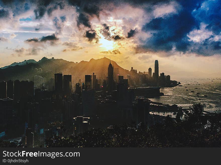 Bird&#x27;s Eye View of City Near Ocean During Sunset