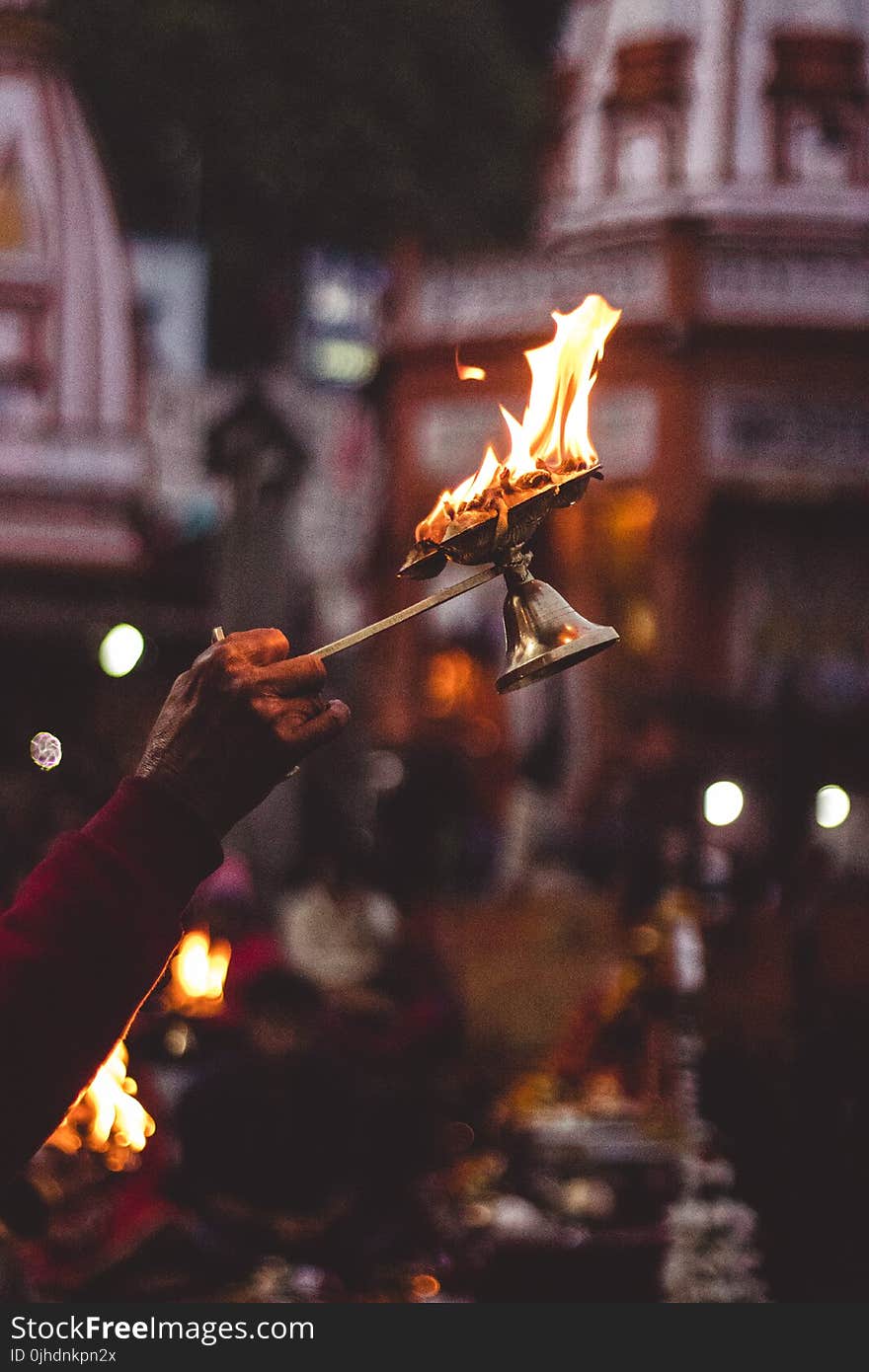 Person Holding Lamp With Flame