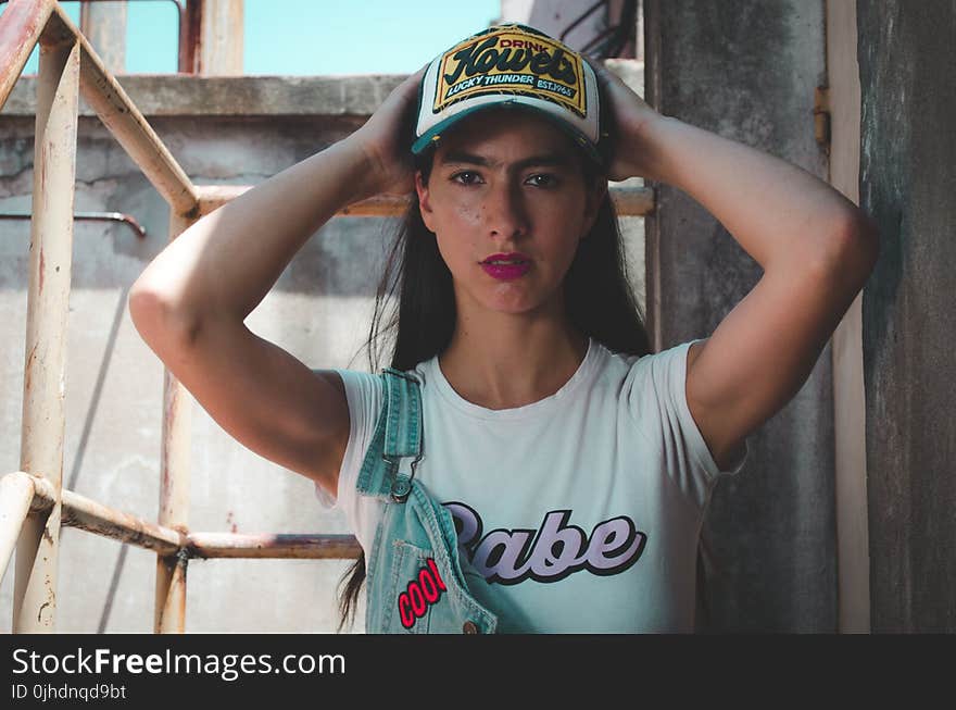 Portrait Photograph of Woman Wearing White Crew-neck Cap-sleeved Shirt